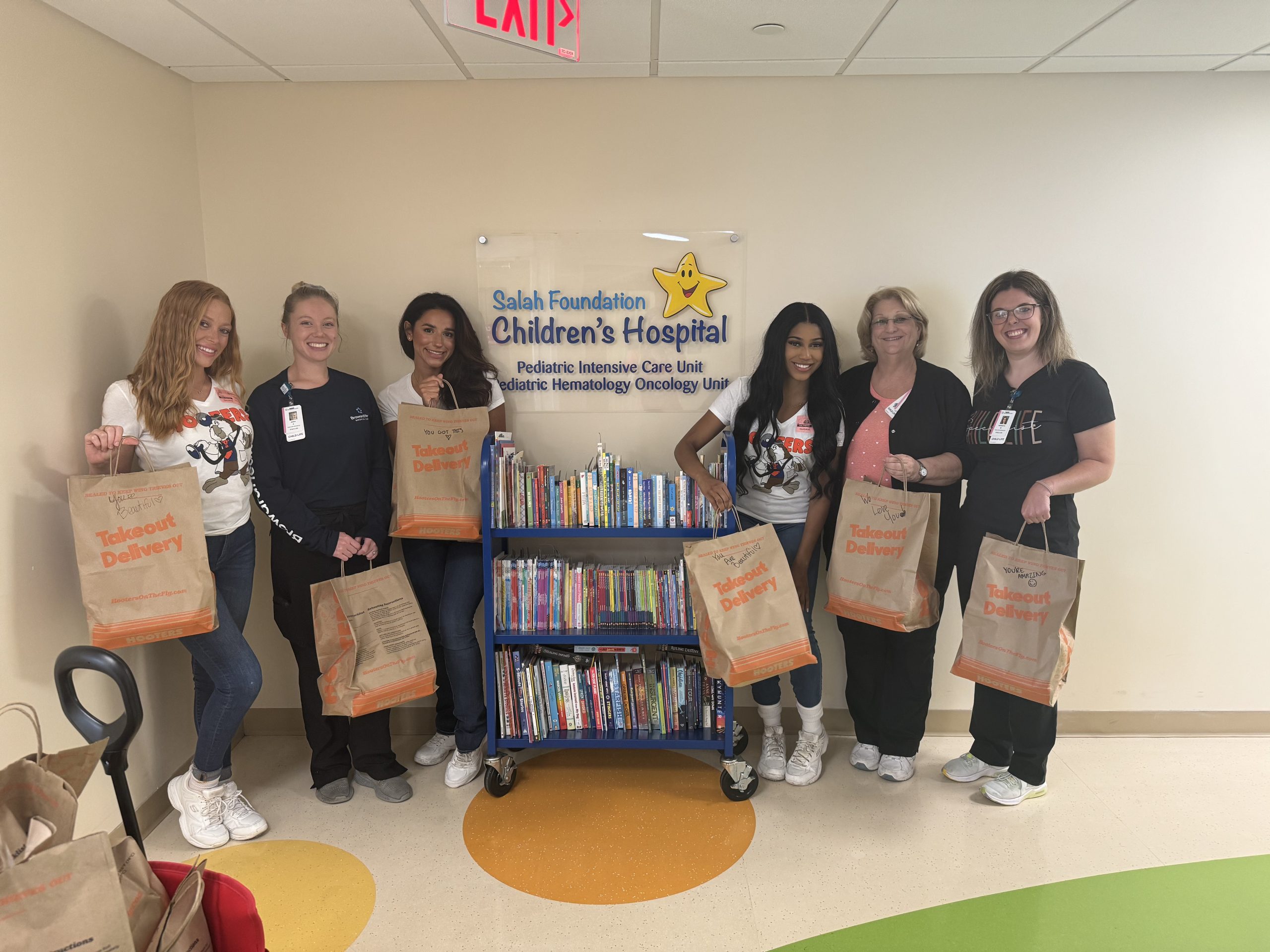 Hooters Beach Place employees visit Salah Children's Hospital