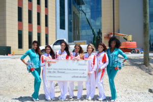 posing with large check