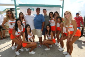 outside pose with Dolphins and Hooters ladies